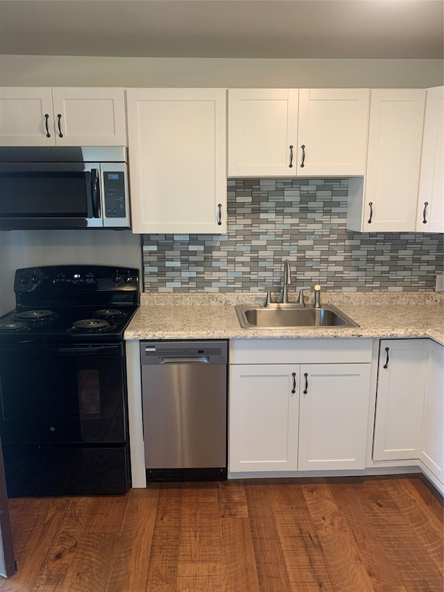 kitchen featuring sink, white cabinetry, and stainless steel appliances