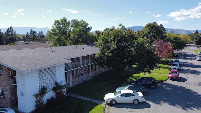 birds eye view of property with a mountain view