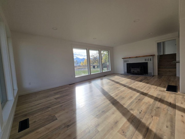 unfurnished living room featuring hardwood / wood-style floors