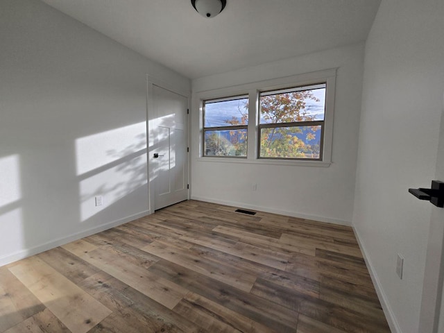 empty room featuring hardwood / wood-style flooring