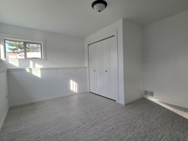 unfurnished bedroom with a closet