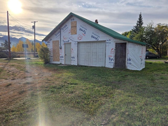 garage with a lawn