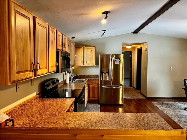 kitchen featuring stainless steel fridge, range with electric cooktop, lofted ceiling with beams, and sink