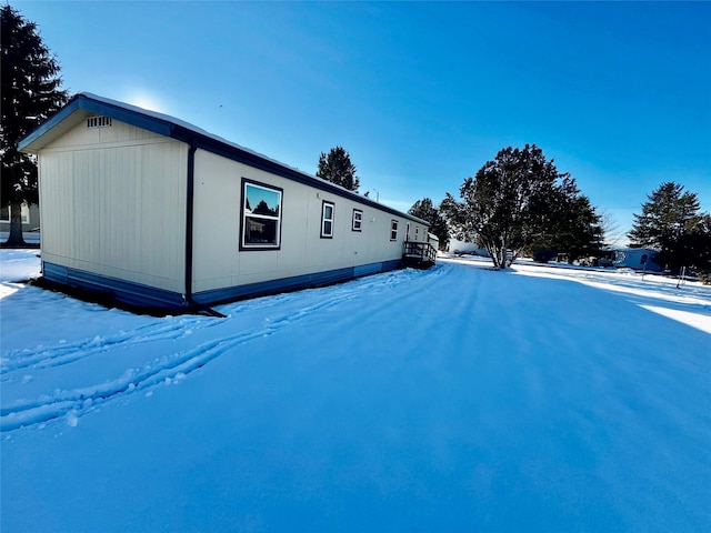 view of snow covered property