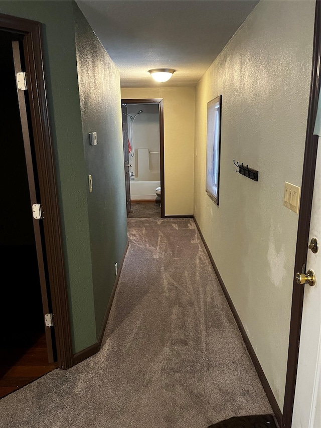 corridor with dark carpet