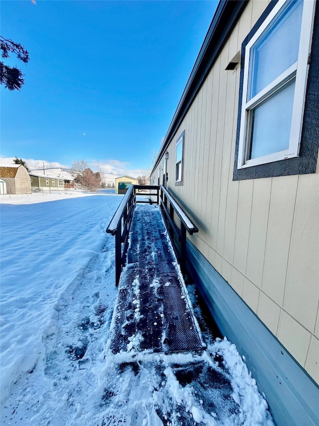 view of yard layered in snow