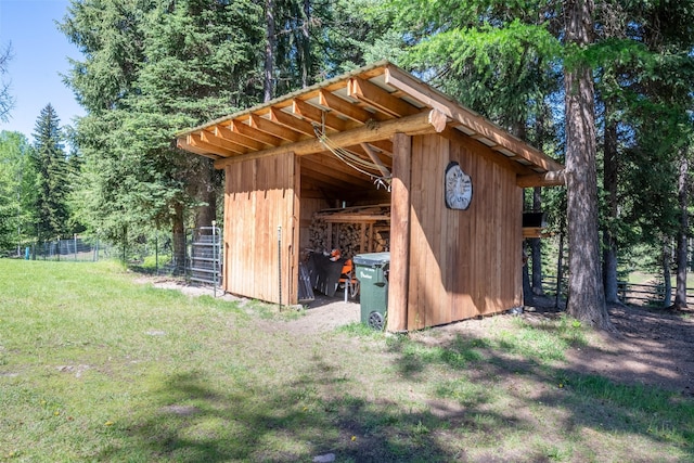 view of outdoor structure featuring a yard