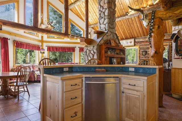 kitchen with stainless steel dishwasher, high vaulted ceiling, tile patterned floors, wooden ceiling, and light brown cabinets