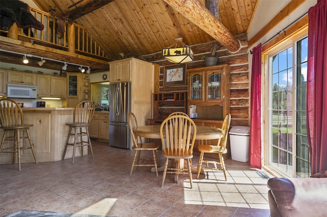 tiled dining space with beam ceiling, wooden ceiling, log walls, and high vaulted ceiling