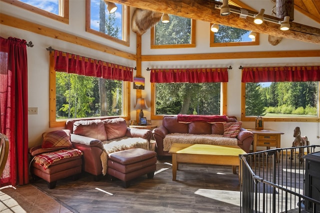 sunroom / solarium featuring lofted ceiling