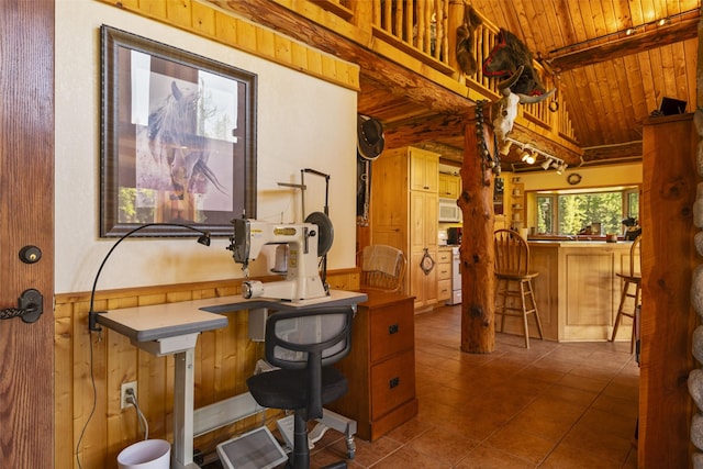 tiled office with wood ceiling, wooden walls, and lofted ceiling with beams