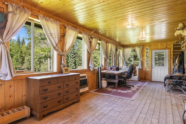 sunroom with heating unit and wood ceiling