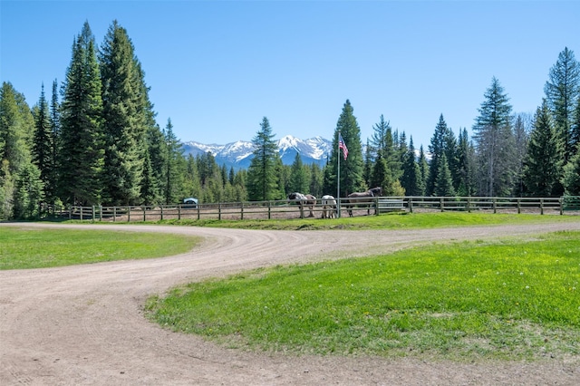 surrounding community featuring a rural view and a mountain view