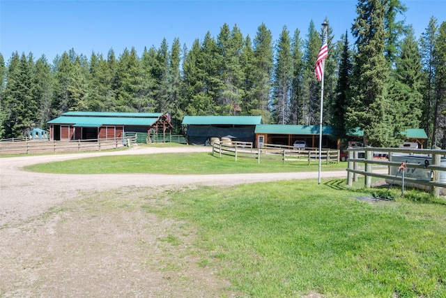 view of home's community with a rural view and an outdoor structure