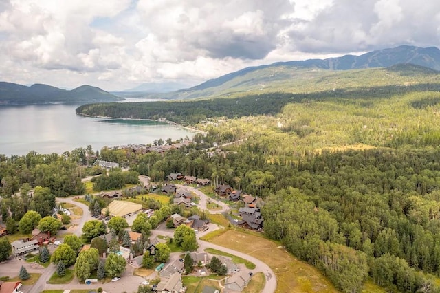 aerial view featuring a water and mountain view