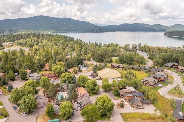 bird's eye view with a water and mountain view