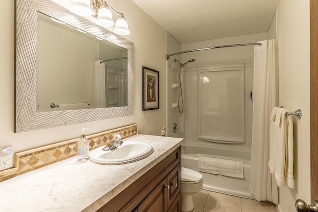 full bathroom with tile patterned floors, shower / bathtub combination with curtain, vanity, and toilet