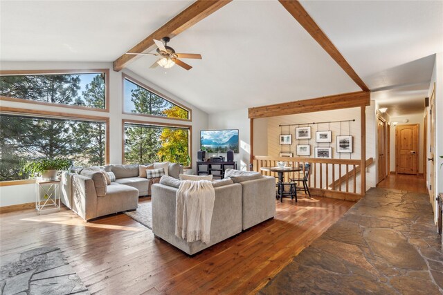 living room featuring ceiling fan, beamed ceiling, high vaulted ceiling, and hardwood / wood-style flooring