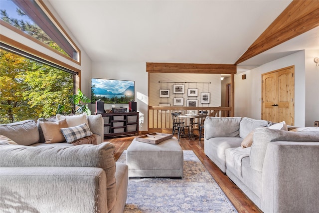 living room featuring hardwood / wood-style floors and lofted ceiling