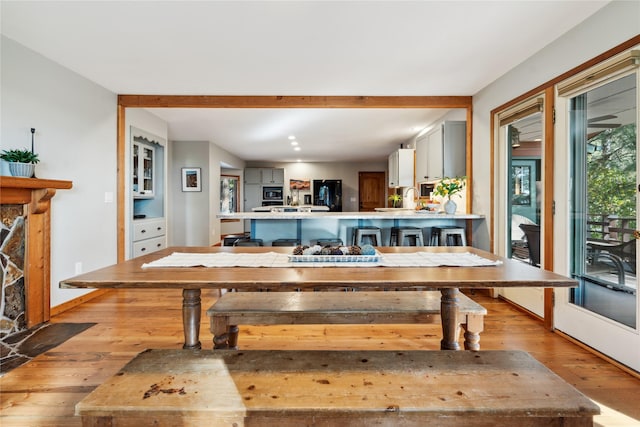 dining space with light wood-type flooring