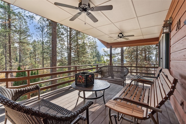 wooden terrace featuring ceiling fan