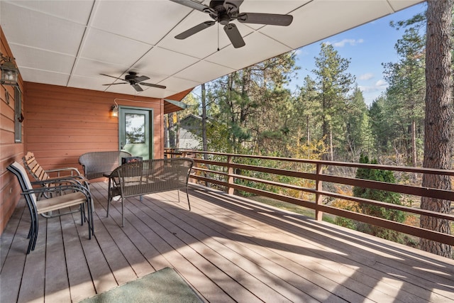 wooden terrace featuring outdoor lounge area and ceiling fan