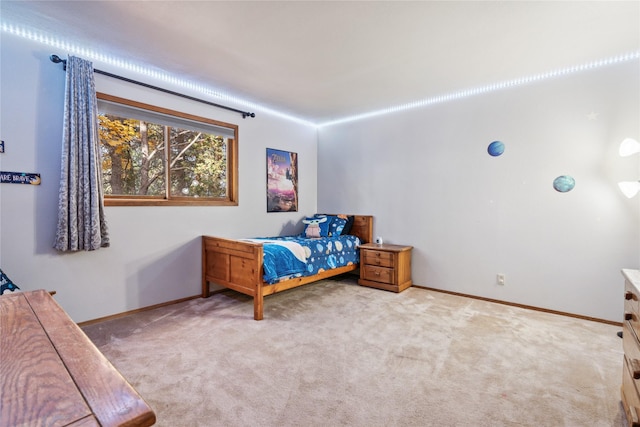 unfurnished bedroom featuring light colored carpet