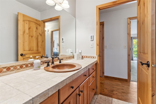 bathroom featuring tile patterned flooring and vanity