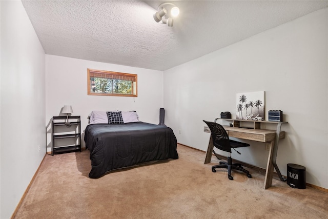 carpeted bedroom with a textured ceiling