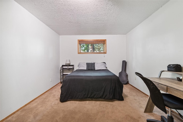 carpeted bedroom featuring a textured ceiling