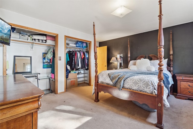 bedroom featuring light colored carpet