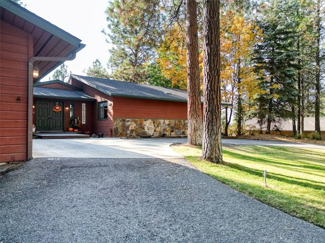 view of home's exterior with a yard