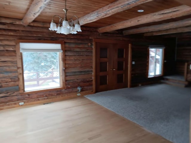 interior space with beam ceiling, log walls, wood ceiling, and a notable chandelier