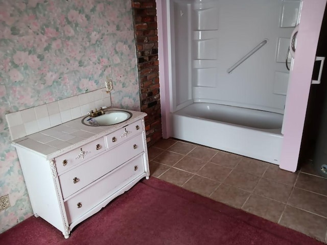 bathroom featuring tile patterned flooring, decorative backsplash, vanity, and shower / bath combination