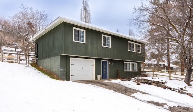 view of front of property with a garage