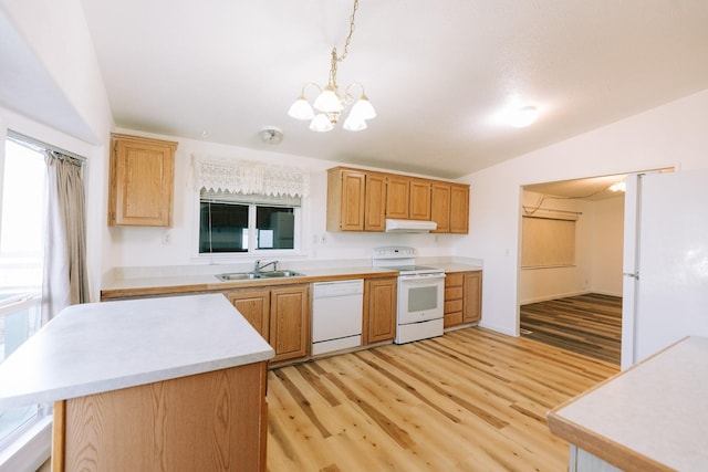 kitchen featuring an inviting chandelier, pendant lighting, lofted ceiling, white appliances, and light wood-type flooring