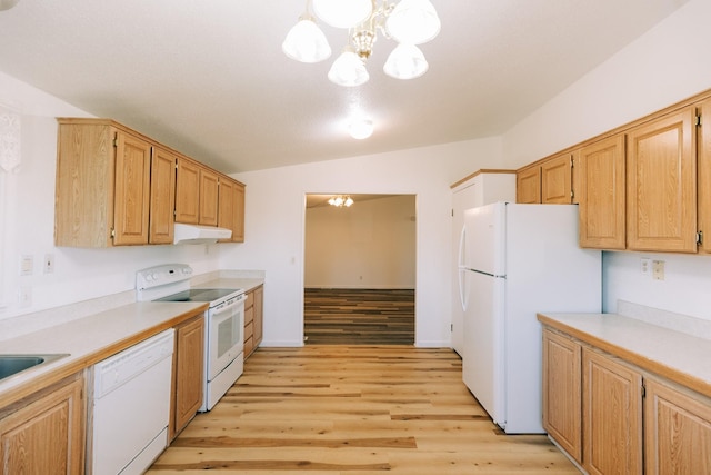 kitchen featuring white appliances, vaulted ceiling, pendant lighting, light hardwood / wood-style flooring, and a notable chandelier