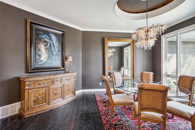 dining room featuring visible vents, crown molding, baseboards, dark wood finished floors, and a notable chandelier