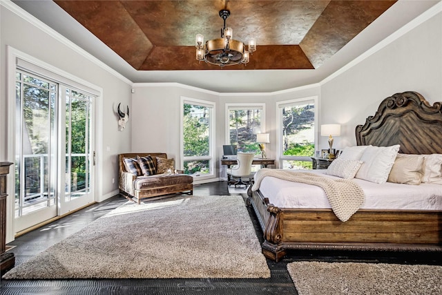 bedroom with a raised ceiling, access to outside, a notable chandelier, and ornamental molding