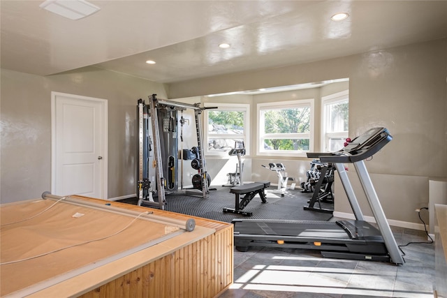 workout room with recessed lighting and baseboards