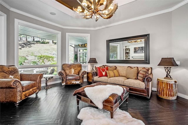 living area featuring an inviting chandelier, baseboards, and ornamental molding