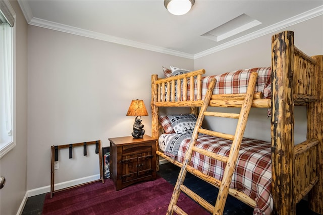 bedroom with carpet flooring, crown molding, and baseboards