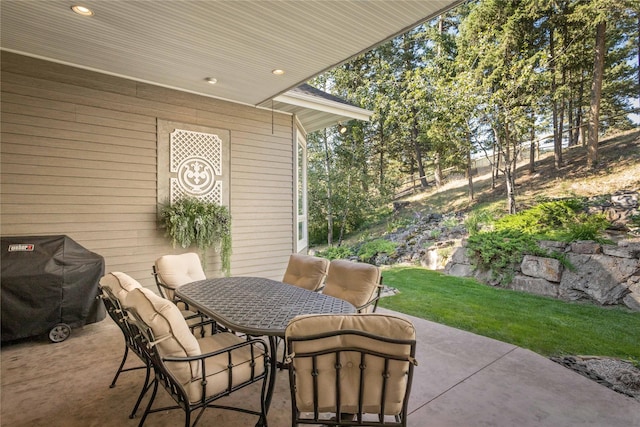 view of patio with outdoor dining space and area for grilling