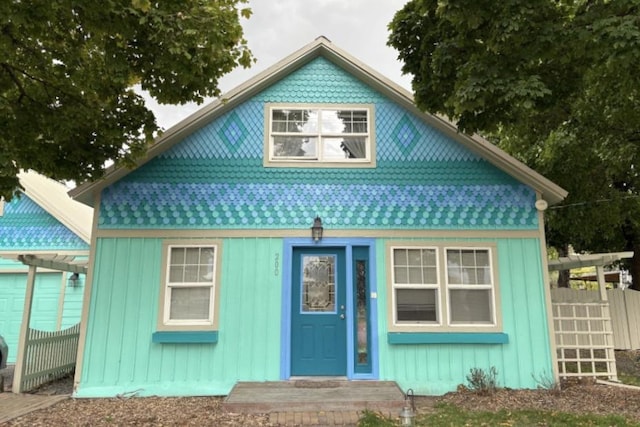 view of front of home featuring an outbuilding