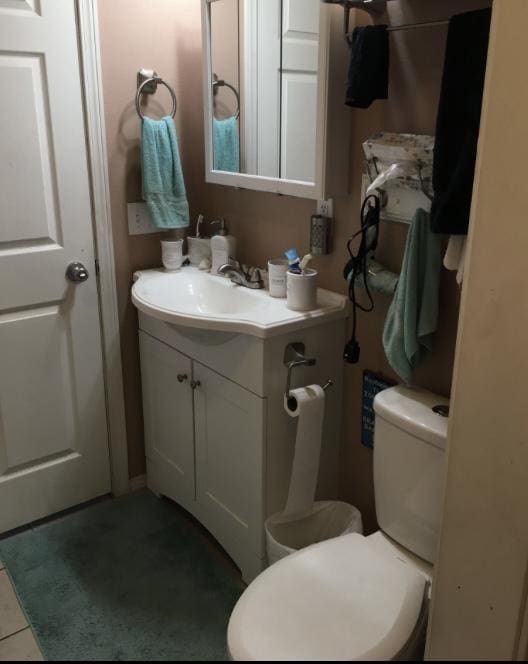 200 Clayton St, Plains, MT 59859 - bathroom with tile patterned flooring, toilet, and vanity