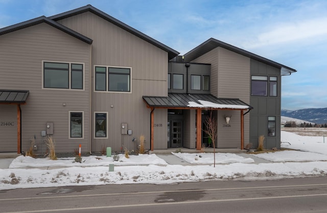 view of front of property with a mountain view