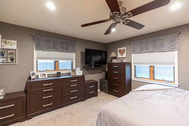 carpeted bedroom featuring ceiling fan