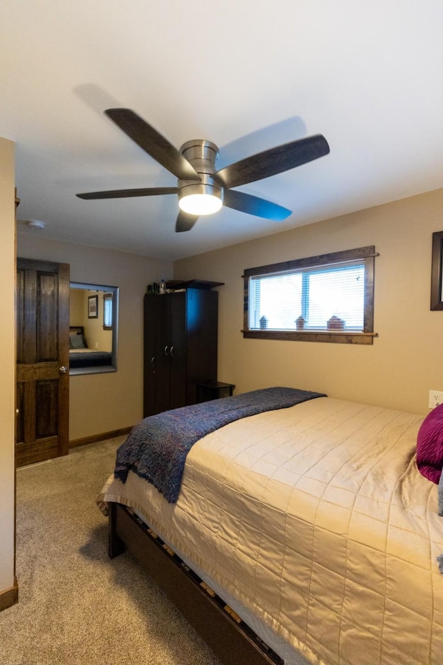 bedroom with ceiling fan and carpet flooring