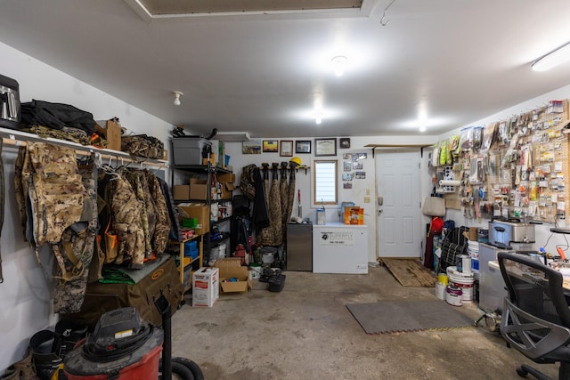 garage featuring fridge and a workshop area