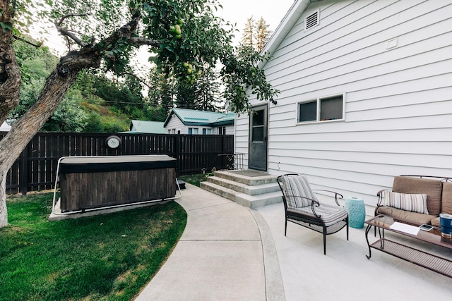 view of patio / terrace featuring a hot tub